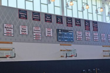 Cloth player recognition banners are UConn basketball practice facility